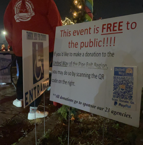 a sign for the prancer path holiday light event stating it's free to the public